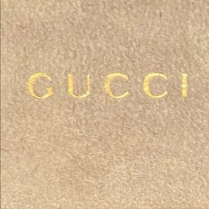 Gucci sunglass case.